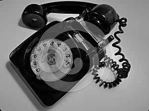 A vintage and antique telephone with white background. photo